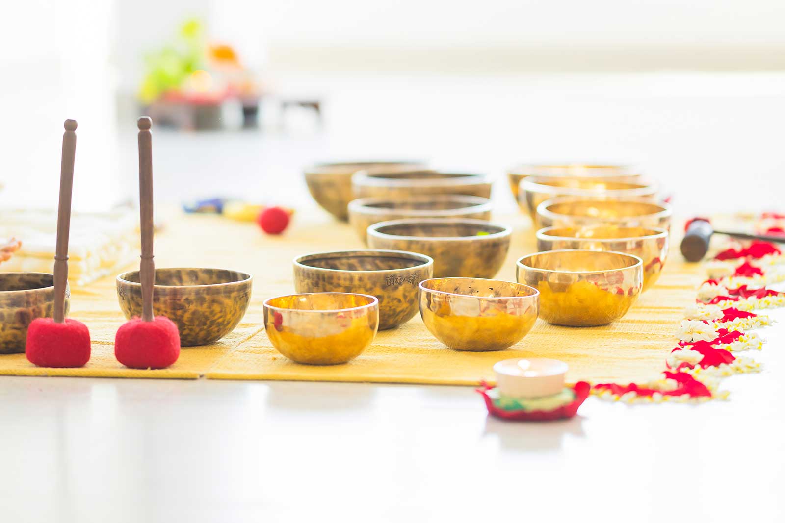 Set of Tibetan singing bowls used for sound healing therapy at Tanmatraa Healing