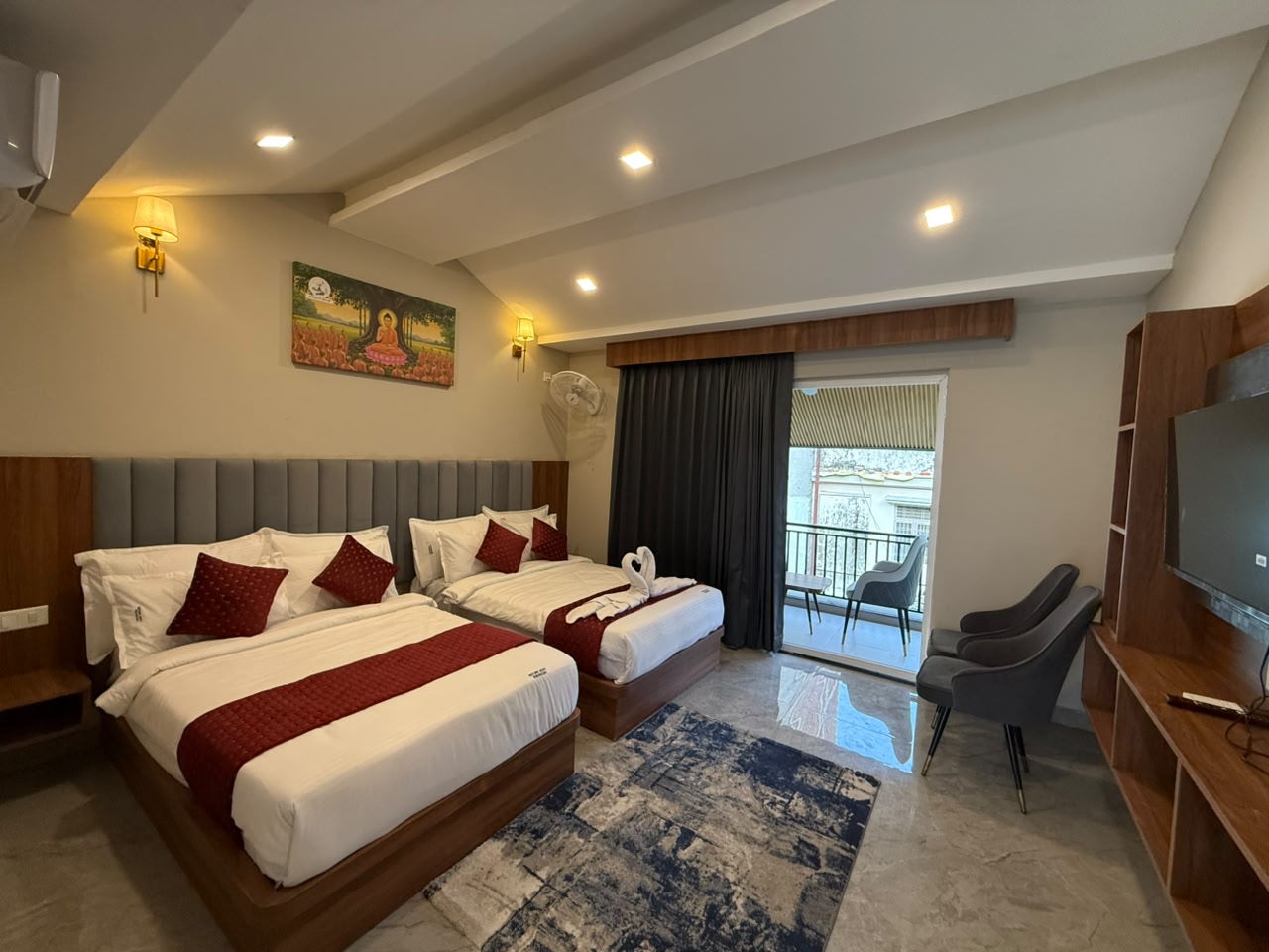Twin beds in a room opening onto a balcony